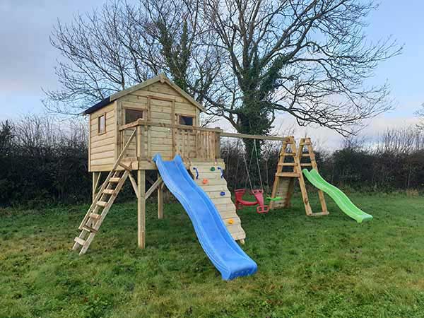Forest Playhouse With Double Slides