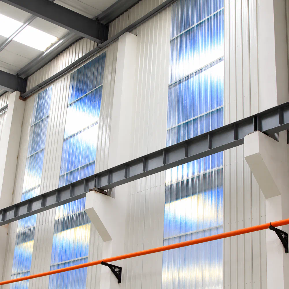 Translucent corrugated sheeting installed in a building